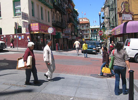 Seniors walking on the sidewalk in Chinatown
